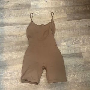 Cute brown unitard. Never worn.
